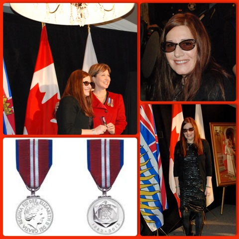 Suzi receiving the Queen Elizabeth II Diamond Jubilee Medal